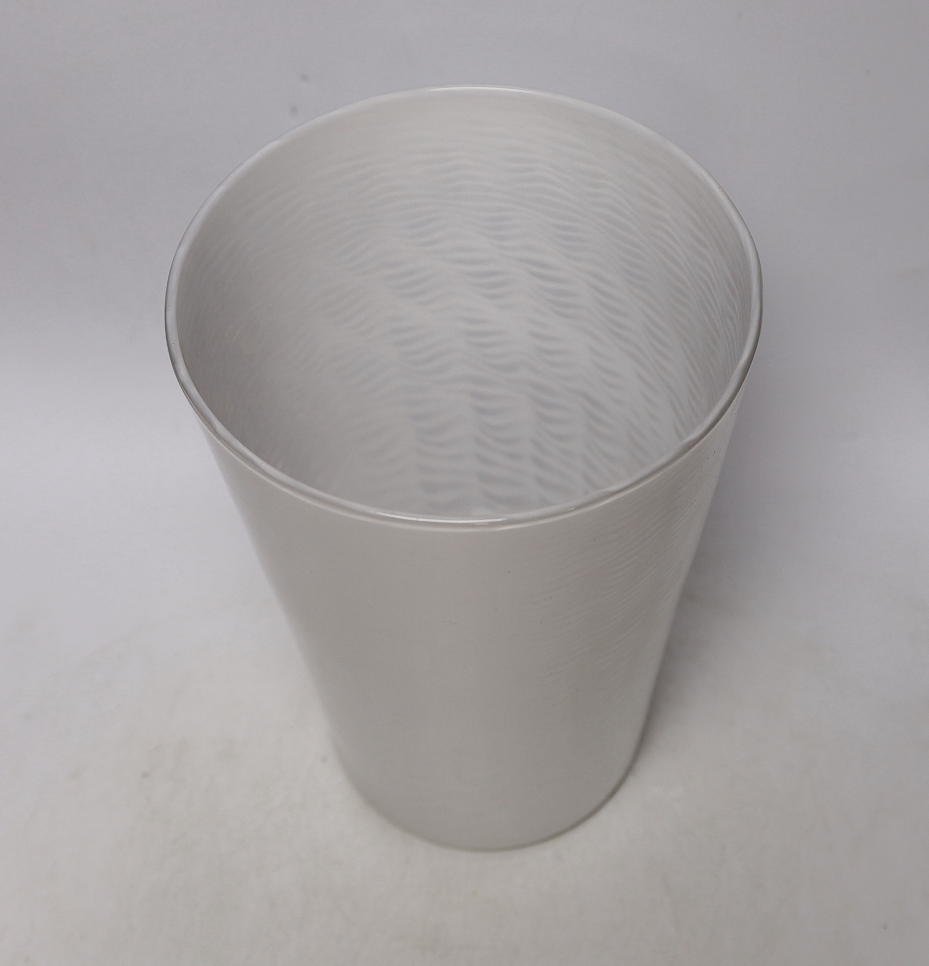 A Whitefriars ‘cloudy white lattice’ glass beaker vase, 30cm high